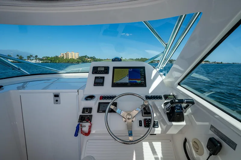 Seaclusion Yacht Photos Pics Helm of 2018 Albemarle 290 Express Fisherman with navigation equipment and ocean view.