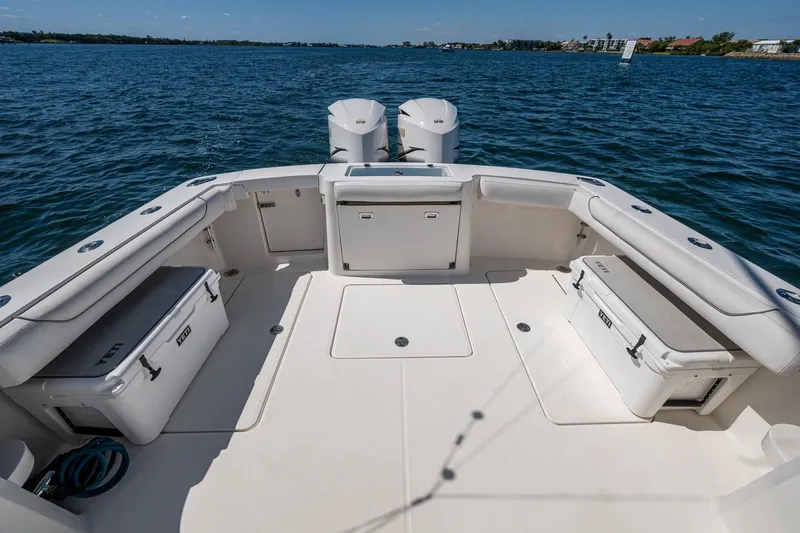 Seaclusion Yacht Photos Pics 2018 Albemarle 290 Express Fisherman boat deck with seating and storage, on open water.