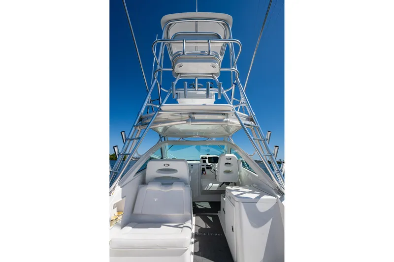 Seaclusion Yacht Photos Pics 2018 Albemarle 290 Express Fisherman boat interior with tower and seating, under clear blue sky.