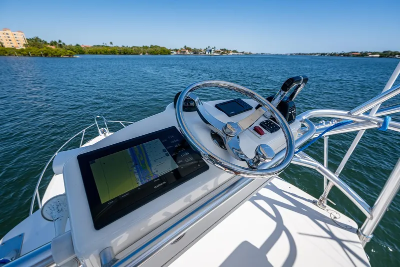 Seaclusion Yacht Photos Pics 2018 Albemarle 290 Express Fisherman helm with navigation system on calm waters.