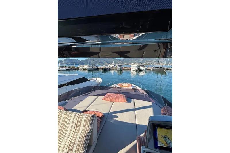  Yacht Photos Pics Luxurious 2025 Ferretti Yachts 720 with spacious deck, docked in scenic marina.