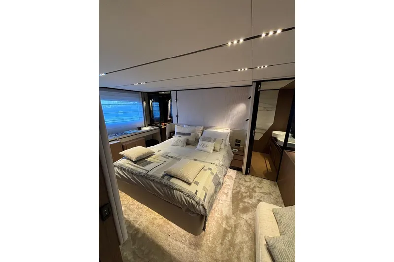  Yacht Photos Pics Luxurious bedroom interior of 2025 Ferretti Yachts 720 with modern design and elegant furnishings.