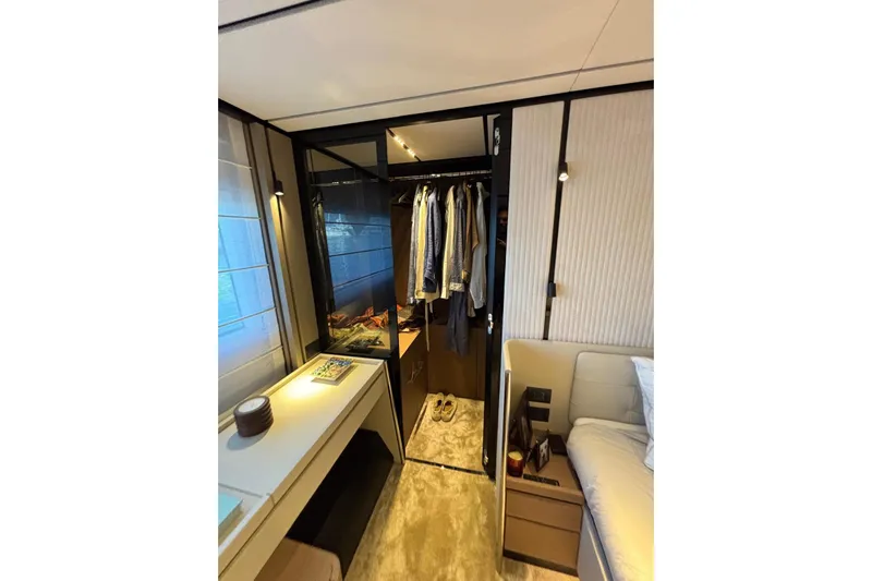  Yacht Photos Pics Luxurious bedroom interior of 2025 Ferretti Yachts 720, featuring modern design and elegant furnishings.