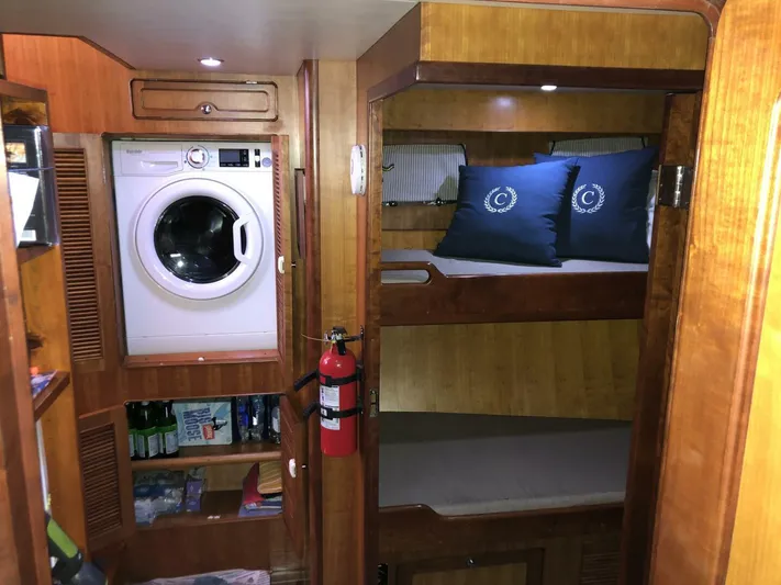 Off The Grid Yacht Photos Pics Interior of 2001 Selene Ocean Trawler with bunk beds and washing machine.
