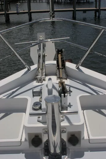 Off The Grid Yacht Photos Pics 2001 Selene Ocean Trawler bow with anchor system, docked in calm waters.