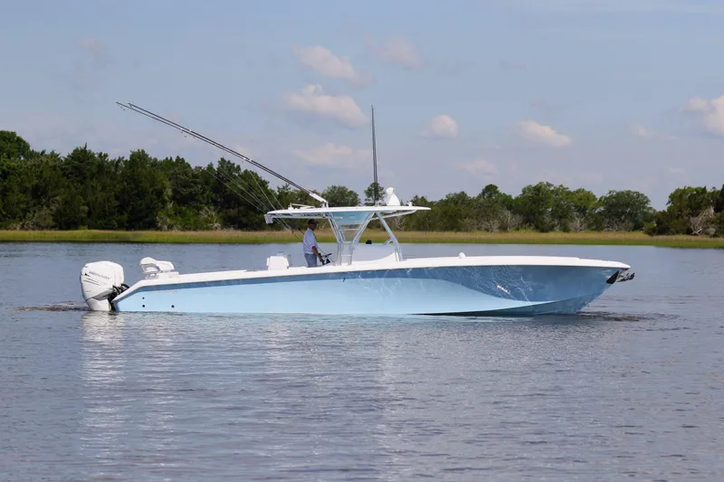  Yacht Photos Pics 2019 Bahama 41 boat cruising on calm water with scenic background.