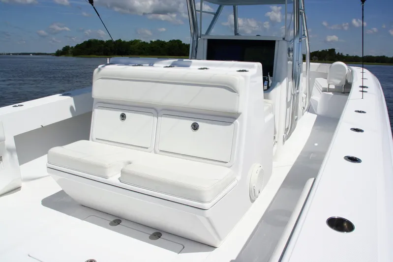  Yacht Photos Pics 2019 Bahama 41 boat with white seating, sleek design, and spacious deck on a sunny day.