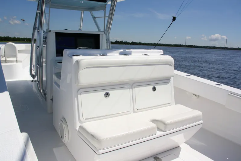  Yacht Photos Pics 2019 Bahama 41 boat interior with white seating and storage, on calm water.