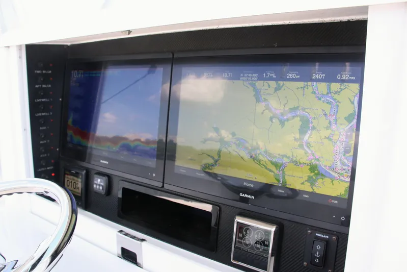  Yacht Photos Pics Control panel of a 2019 Bahama 41 boat with Garmin navigation displays.