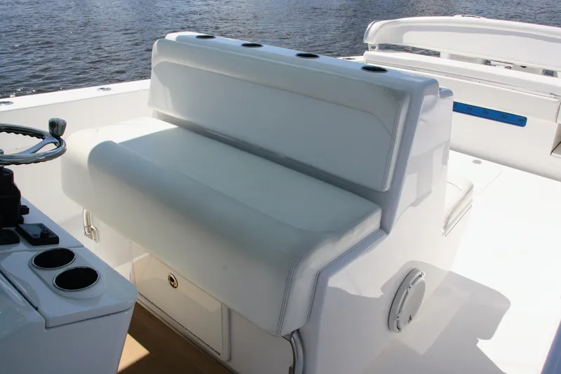  Yacht Photos Pics 2019 Bahama 41 boat interior with white seating and steering wheel.