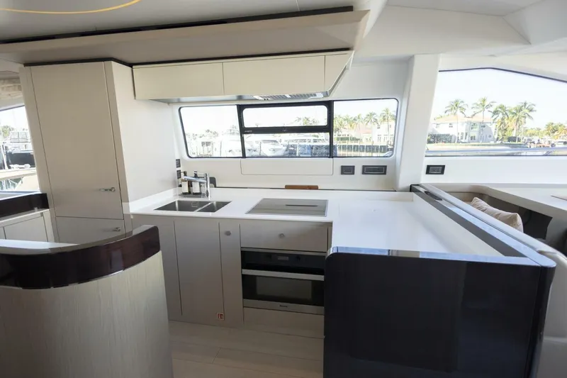 Rho Boat Yacht Photos Pics Modern kitchen interior of 2021 Azimut Fly 72 yacht with sleek design and appliances.