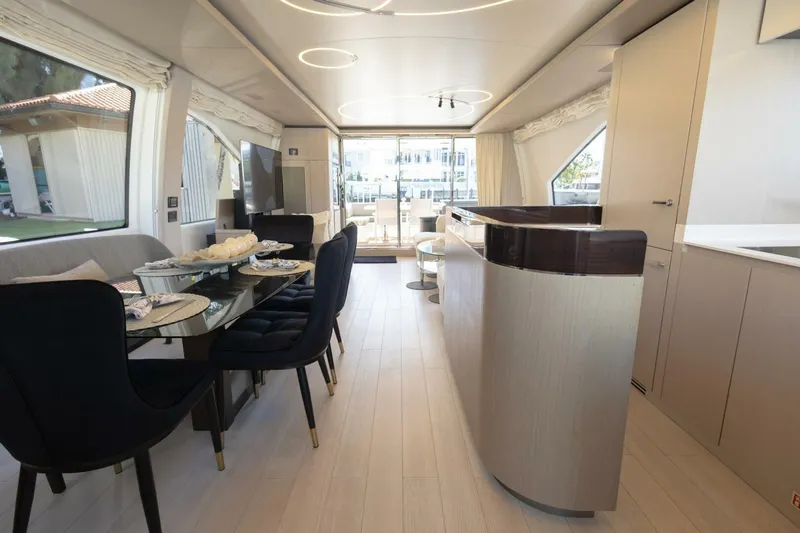 Rho Boat Yacht Photos Pics Luxurious interior of 2021 Azimut Fly 72 yacht with elegant dining area and modern design.
