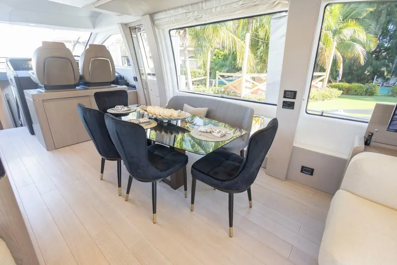 Rho Boat Yacht Photos Pics Luxurious interior of 2021 Azimut Fly 72 yacht with elegant dining area.