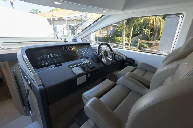 Rho Boat Yacht Photos Pics Luxurious interior of 2021 Azimut Fly 72 yacht with modern dashboard and leather seating.