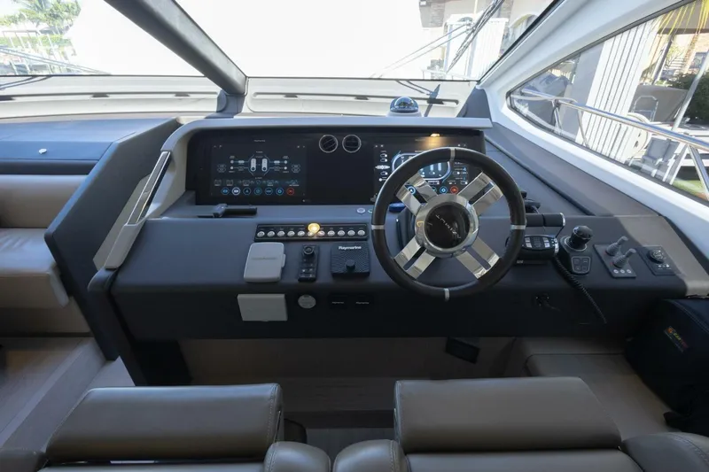 Rho Boat Yacht Photos Pics Helm of 2021 Azimut Fly 72 yacht with modern controls and steering wheel.