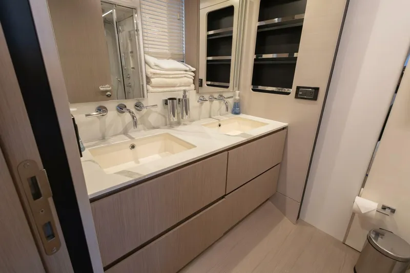 Rho Boat Yacht Photos Pics Luxurious bathroom in 2021 Azimut Fly 72 yacht with dual sinks and modern fixtures.