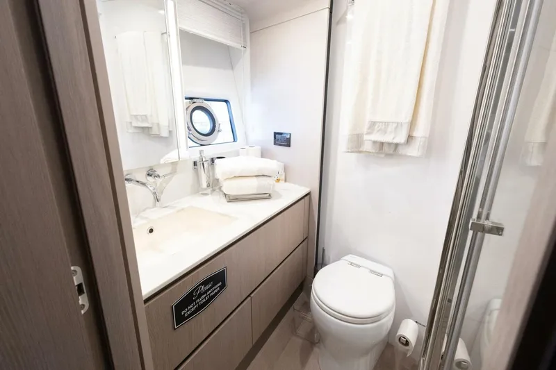 Rho Boat Yacht Photos Pics Luxurious bathroom in 2021 Azimut Fly 72 yacht with modern fixtures and elegant design.