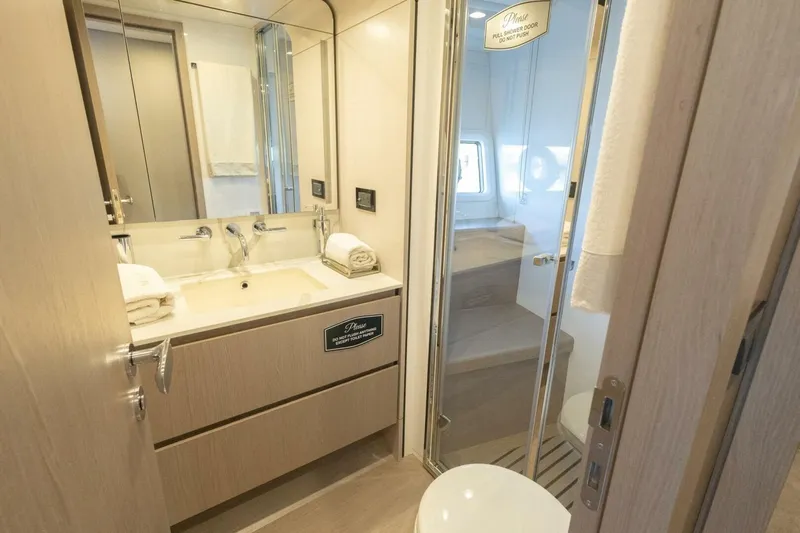 Rho Boat Yacht Photos Pics Luxurious bathroom interior of 2021 Azimut Fly 72 yacht with modern fixtures.