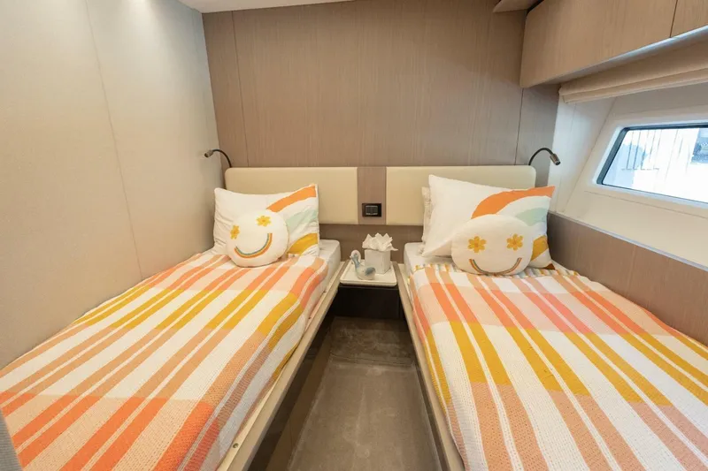 Rho Boat Yacht Photos Pics Interior of 2021 Azimut Fly 72 yacht with twin beds and colorful decor.
