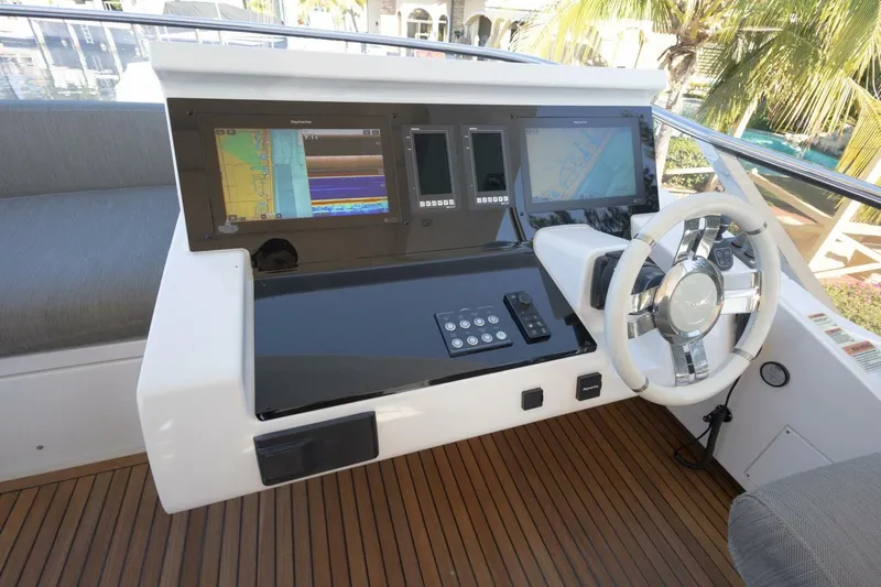Rho Boat Yacht Photos Pics Cockpit of 2021 Azimut Fly 72 yacht with modern navigation displays and steering wheel.