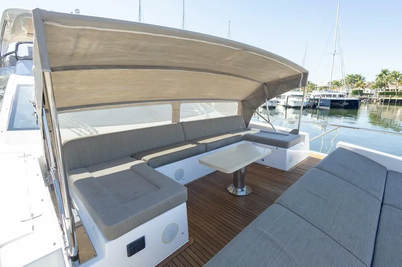 Rho Boat Yacht Photos Pics Luxurious 2021 Azimut Fly 72 yacht with spacious outdoor seating and canopy.