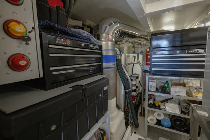 Rho Boat Yacht Photos Pics Engine room of 2021 Azimut Fly 72 yacht with toolboxes and equipment.