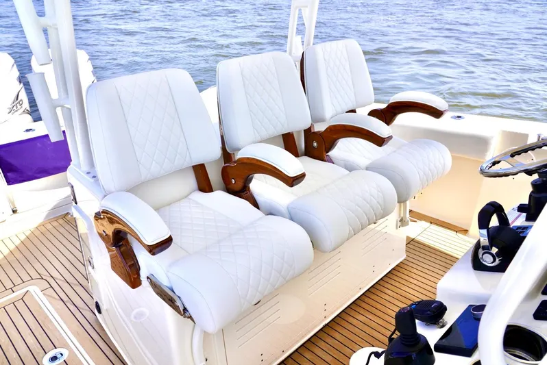  Yacht Photos Pics Luxurious seating on 2020 Cobia 350 Center Console boat with white upholstery.