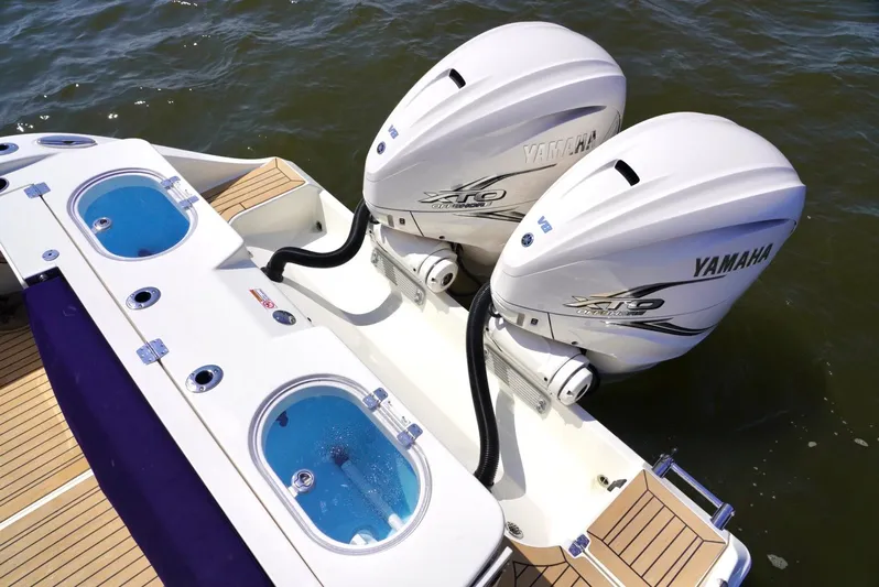  Yacht Photos Pics 2020 Cobia 350 Center Console with twin Yamaha outboard engines on water.