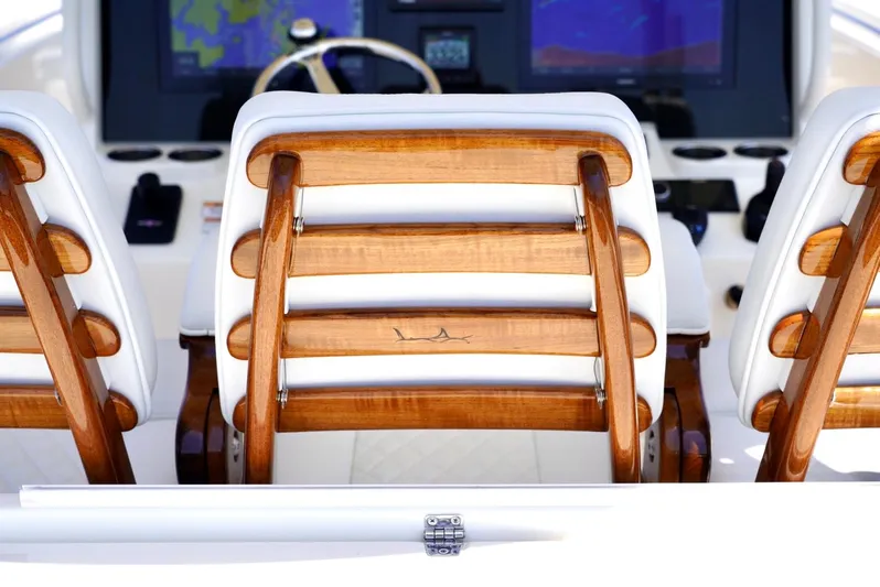  Yacht Photos Pics 2020 Cobia 350 Center Console boat with wooden seating and navigation display.