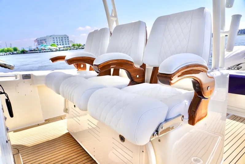  Yacht Photos Pics Luxurious seating on 2020 Cobia 350 Center Console boat with waterfront view.