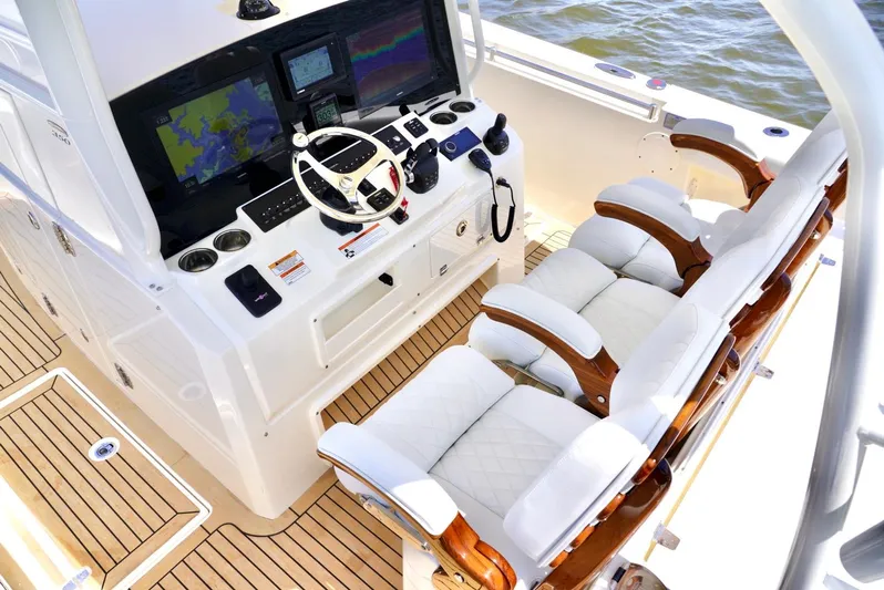  Yacht Photos Pics 2020 Cobia 350 Center Console boat cockpit with advanced navigation system and luxurious seating.