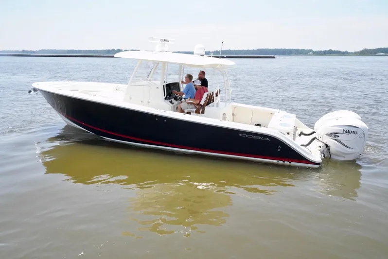  Yacht Photos Pics 2020 Cobia 350 Center Console boat on calm water, featuring dual Yamaha outboard engines.