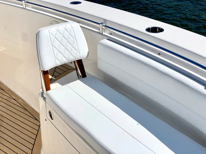  Yacht Photos Pics 2020 Cobia 350 Center Console boat with white seating and wooden accents.