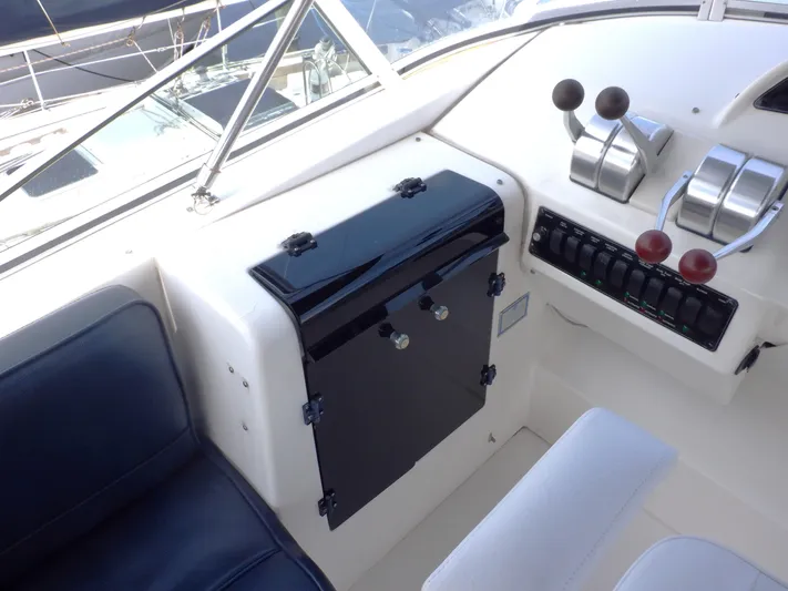 Epic Yacht Photos Pics 1998 Bayliner 4788 Pilothouse Motoryacht helm with controls and seating.