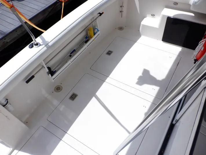 Epic Yacht Photos Pics 1998 Bayliner 4788 Pilothouse Motoryacht deck with storage compartments and safety equipment.