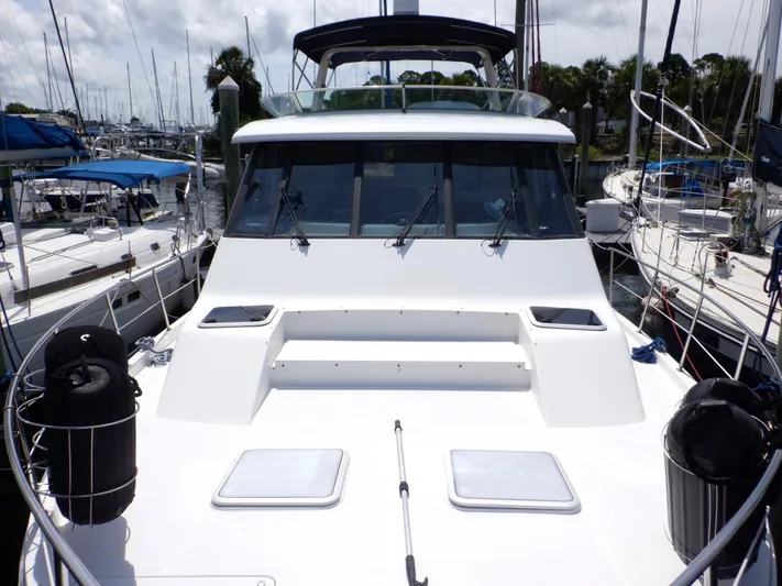 Epic Yacht Photos Pics 1998 Bayliner 4788 Pilothouse Motoryacht docked at marina, surrounded by sailboats.