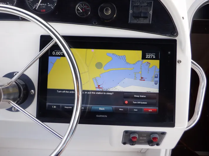 Epic Yacht Photos Pics Steering wheel and navigation display on 1998 Bayliner 4788 Pilothouse Motoryacht.