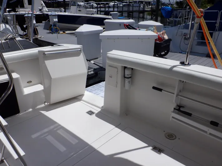 Epic Yacht Photos Pics 1998 Bayliner 4788 Pilothouse Motoryacht deck with storage and dock view.