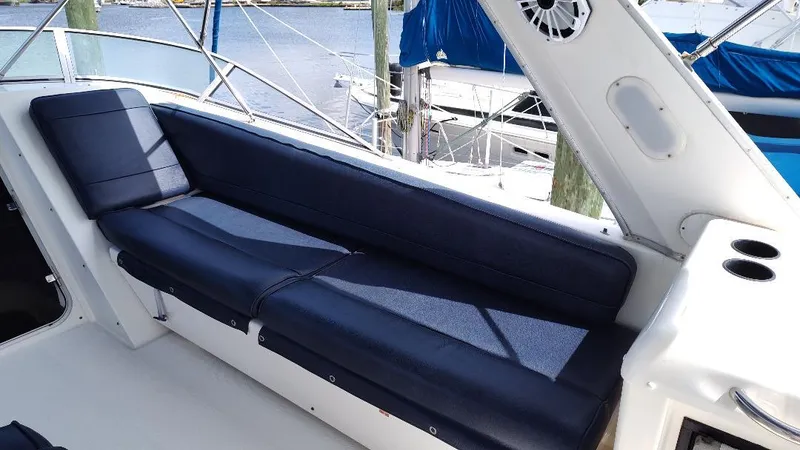 Epic Yacht Photos Pics 1998 Bayliner 4788 Pilothouse Motoryacht interior with blue seating and cup holders.