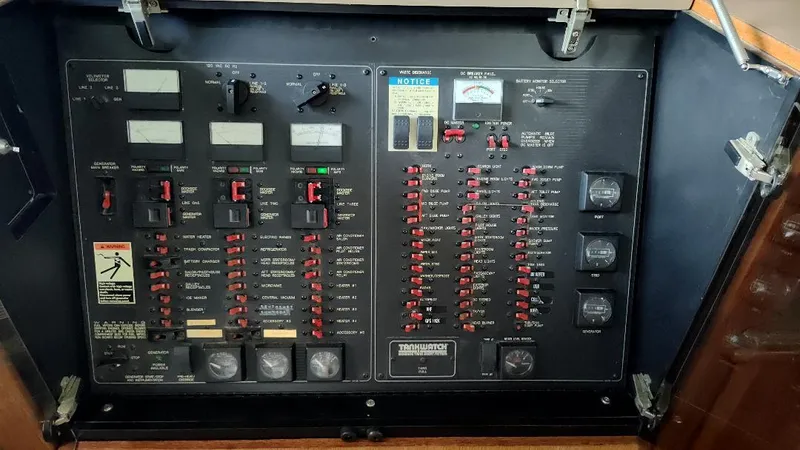 Epic Yacht Photos Pics Electrical control panel of a 1998 Bayliner 4788 Pilothouse Motoryacht with switches and gauges.