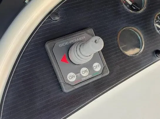 Epic Yacht Photos Pics Control panel of a 1998 Bayliner 4788 Pilothouse Motoryacht with Side-Power thruster joystick.