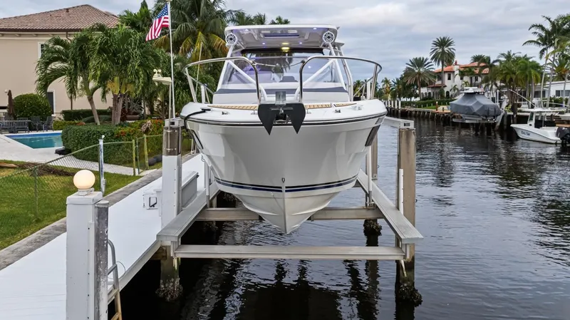  Yacht Photos Pics 2020 Jeanneau Leader 9.0 WA boat docked in a scenic waterfront setting.