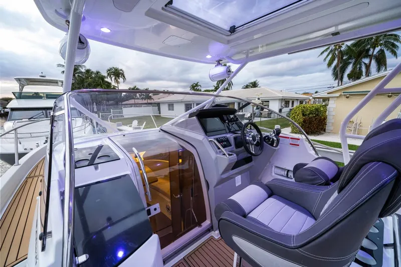  Yacht Photos Pics 2020 Jeanneau Leader 9.0 WA boat interior with modern cockpit and luxurious seating.