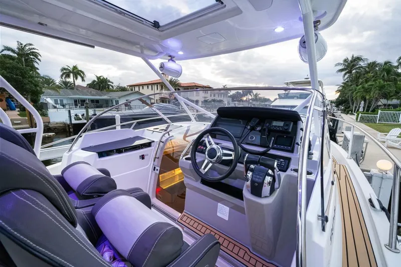  Yacht Photos Pics 2020 Jeanneau Leader 9.0 WA boat interior with modern helm and seating.