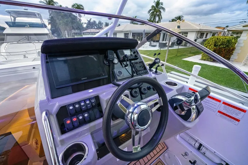  Yacht Photos Pics 2020 Jeanneau Leader 9.0 WA boat helm with modern controls and steering wheel.