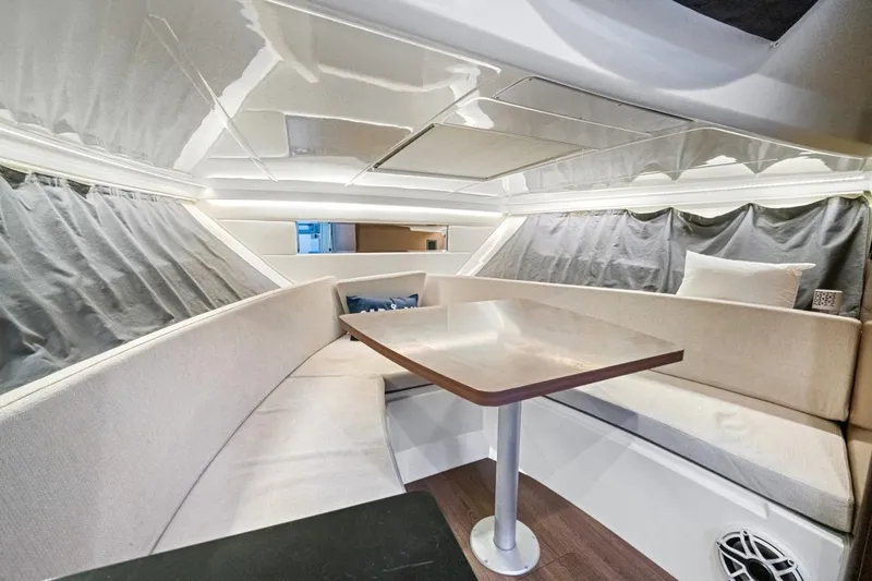  Yacht Photos Pics Interior of 2020 Jeanneau Leader 9.0 WA boat with cozy seating and table.