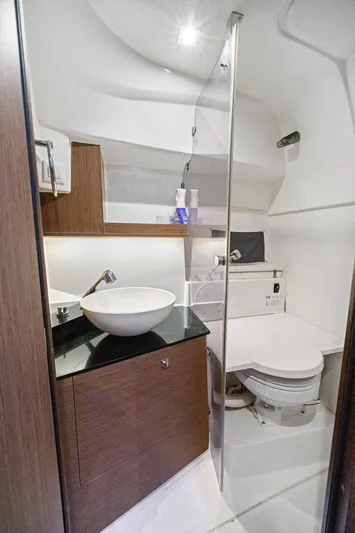  Yacht Photos Pics 2020 Jeanneau Leader 9.0 WA boat bathroom with modern sink and toilet.