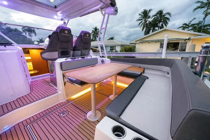  Yacht Photos Pics 2020 Jeanneau Leader 9.0 WA boat interior with seating, table, and ambient lighting.