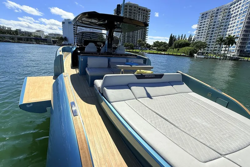  Yacht Photos Pics 2022 Solaris Power 44 yacht with sun deck, docked in a scenic waterfront location.