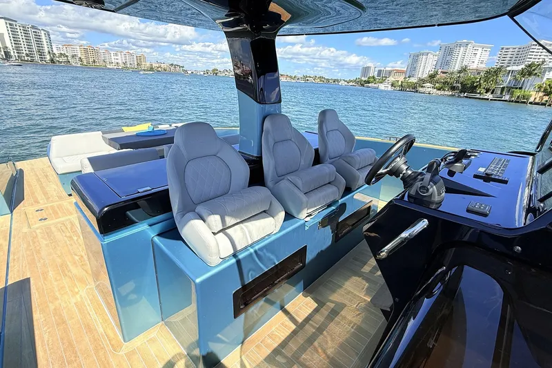  Yacht Photos Pics Luxurious 2022 Solaris Power 44 yacht interior with plush seating and modern controls.